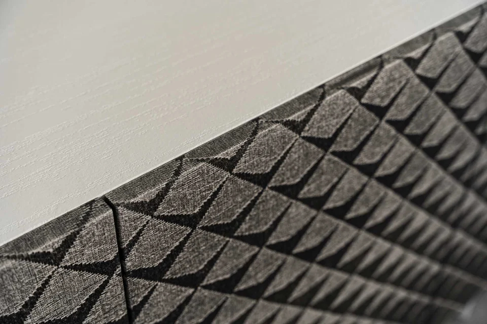 Detail of the geometric Woodress finish and the light cabinet edge
