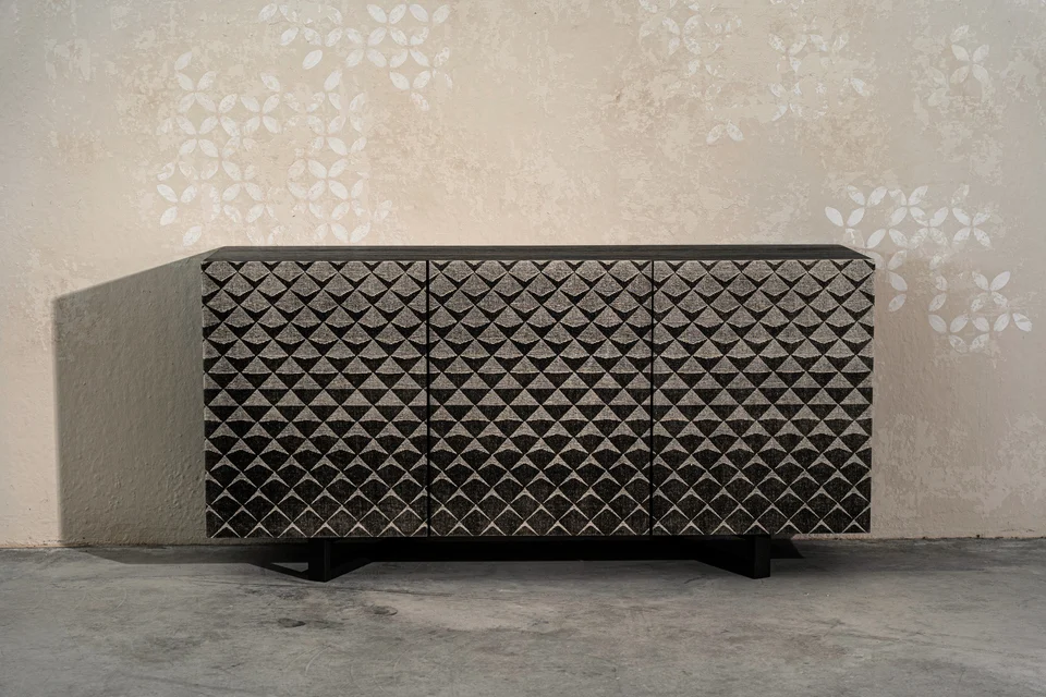 Sideboard with a dark Woodress finish and geometric relief