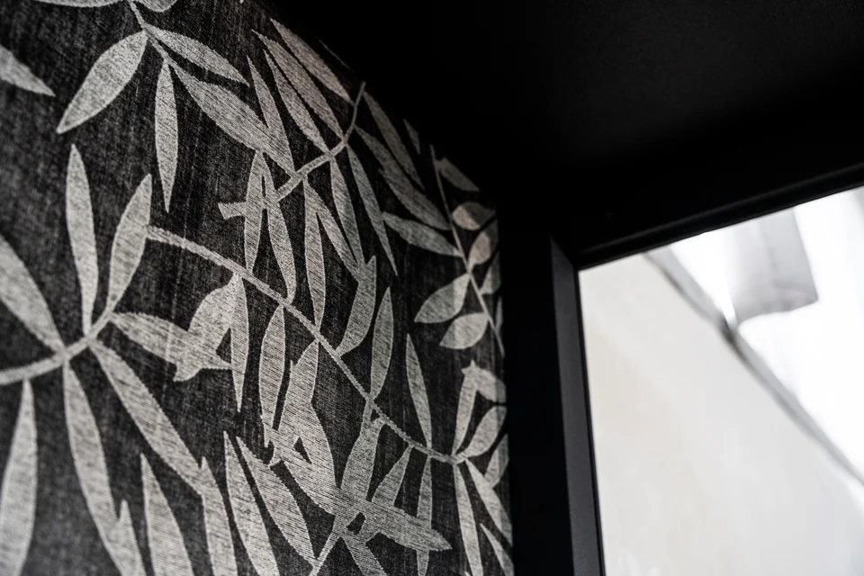 Close-up of the Woodress finish with a woven texture and botanical pattern